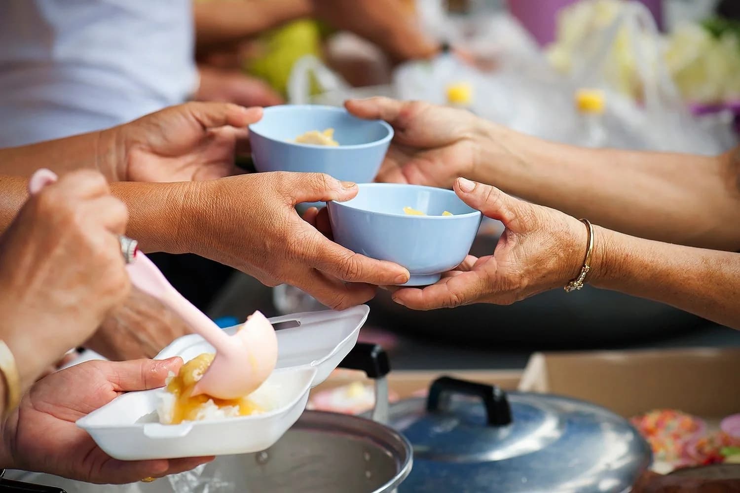 People receiving food and care